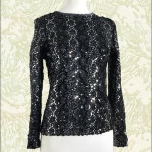 Glowing black and silver evening top